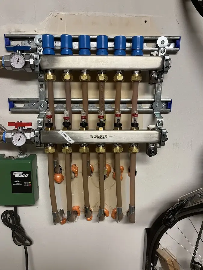 Plumber performing Water Heater Repair at a residential property in Deale